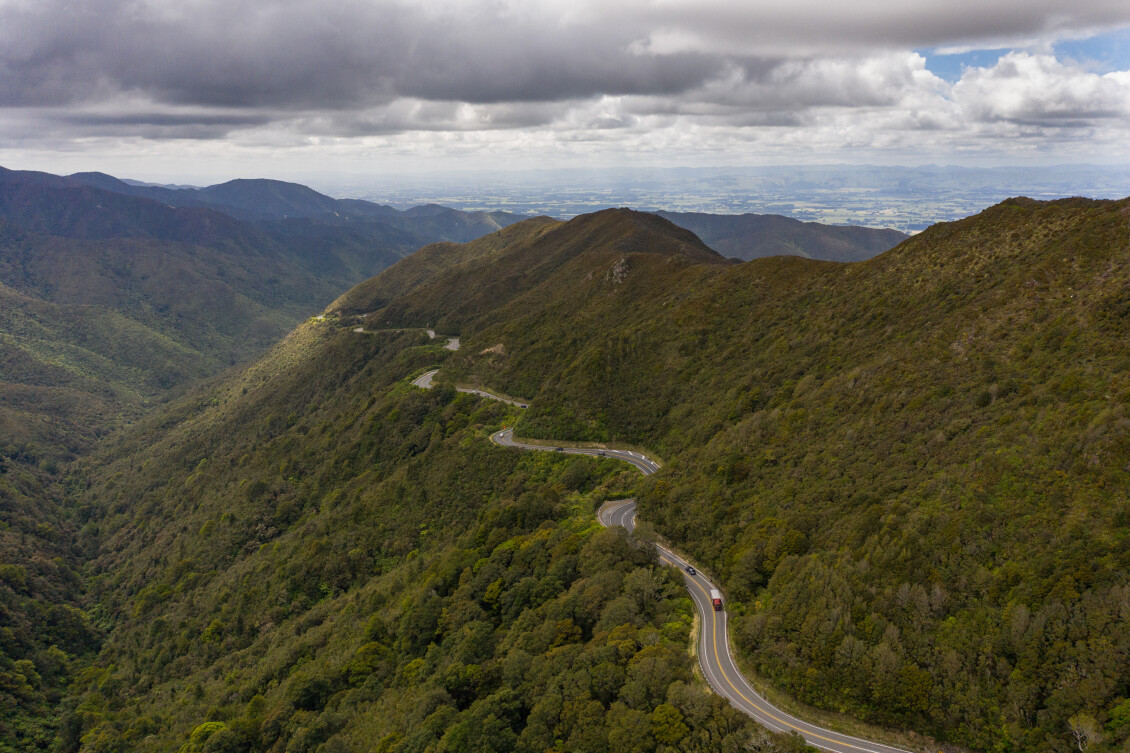 A road winds through the hills in the Wairarapa landscape