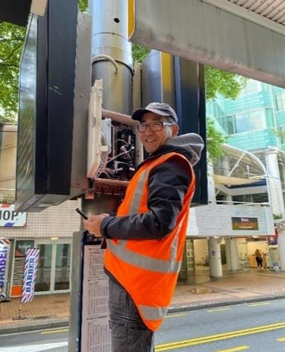 A monitoring officer checks the black carbon monitoring site on Manners Street